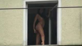 Online film Girlfriend bates on open window in public