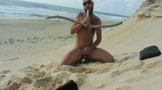 Free online porn Bearded stud fucks himself on beach