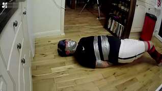 Online film Footballer tied and taped tight on kitchen floor ALTERNATIVE VIEW