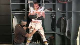 Online film Tall redheaded football player bound gagged and stripped.