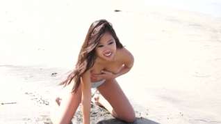 Online film Hot Asian model Audrey in yellow bikini strips on beach