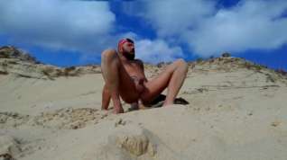 Online film guy fucks himself on the beach with a wooden dildo
