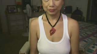 Online film Asian granny toying her pussy on webcam