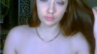 Online film Redhead plays with her big tits on webcam