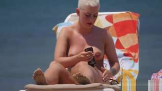 Online film Emo chick with big tits and pierced nipples sunbathing on topless beach