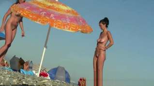 Online film Tight bodied cutie goes nude on a nudist beach voyeur video