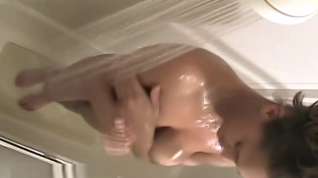 Online film Halle washing her big tan boobs on hidden voyeur shower cam.