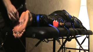Online film mummified foot torture to tears: tickling, flogging, wax.