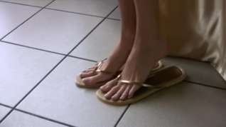 Online film Long feet sliding into cork flip flops