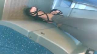 Online film Young Lady in High heeled sandals sitting on the bus
