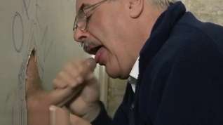 Online film Grey old moustached man giving blowjob through glory hole