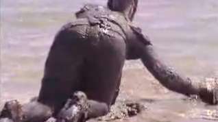 Online film Clothed girl covered in mud