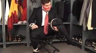 Online film Suited coach tied to chair and cleave gagged in the locker room