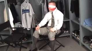 Online film Hunk in shirt and tie bound to chair gagged and blindfolded