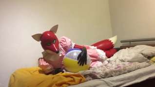 Online film Rubber fox maid plays with beach ball