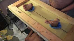Online film Hot wax dripped on dirty soles in stocks