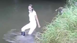 Online film Girl gets wet in creek in riding attire
