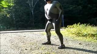 Online film skeleton masked wetsuit on the road