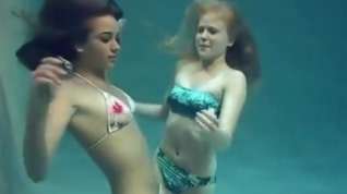 Online film Two girls breath holding and posing underwater