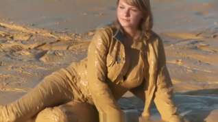 Online film Brunette getting muddy in jeans
