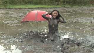 Online film Petite Filipina Jane trashes her slutty little dress in a muddy rice paddy