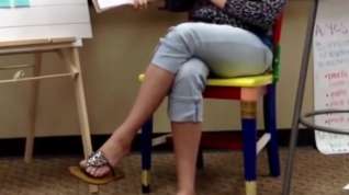 Online film 1st grade teacher playing with flip flops during a lesson