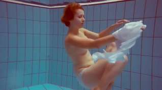 Online film Cute redhead plays naked underwater