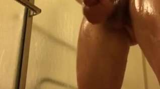 Online film 18 year old oils himself up in the shower, shows himself off, and then cums