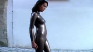 Online film Girl has to walk in latex catsuit on the street because she lost a bet