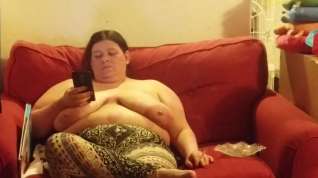 Online film wife chilling on her phone top less smoking