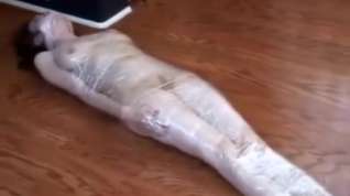 Online film Plasticwrapped mummified girl