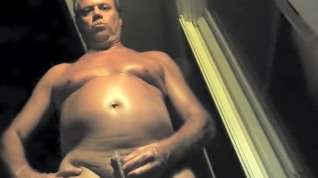 Online film Naked daddy taking a pee at night outdoors.