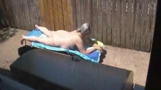 Online film Kim Bates caught laying out in the nude. Enjoy the view.