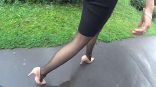 Online film Following candid woman in black pantyhose and high heels