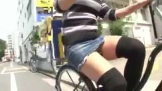 Online film Japanese girl rides a bike with short skirt in streets