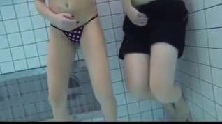 Online film college girl gives handjob and blowjob in public pool
