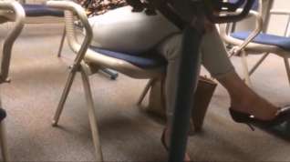 Online film Candid dangling heels under the table coworker lunch