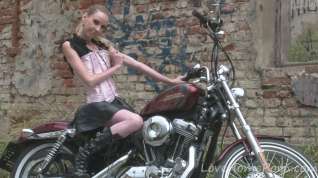Online film Cute teen is amazed by a big bike