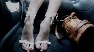 Online film Sexy feet high heels in car