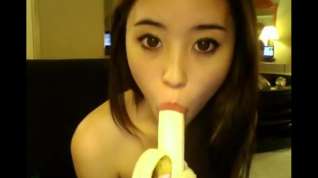 Online film Asian girl with a banana