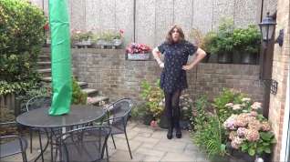 Online film Sexy Crossdresser Alison playinging in the garden