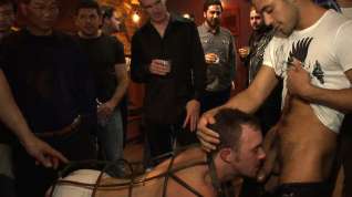 Online film Stud in a metal cage is fucked by horny bar patrons