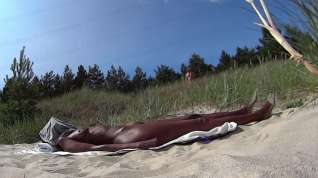 Online film Naked and oily on the beach