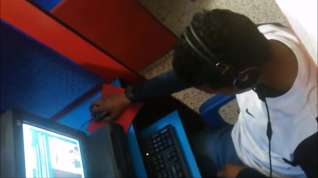 Online film spy guy cum in his hand in cyber cafe