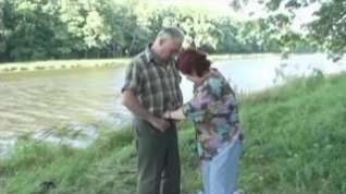 Online film Older Couple on the river bank