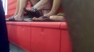 Online film Woman dangling flip flops at the gym