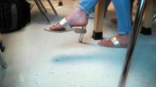 Online film Pretty feet dangling sandals in class 3
