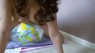 Online film naked girl riding transparent earth beachball