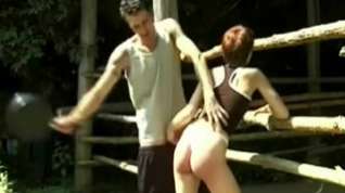 Online film Ranchyard spanking for redhead Eve by Stanley