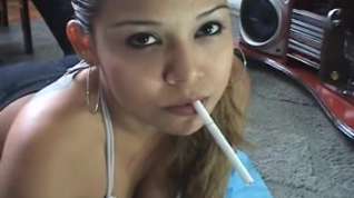 Online film Cute Latina smokes a cigarette on a webcam